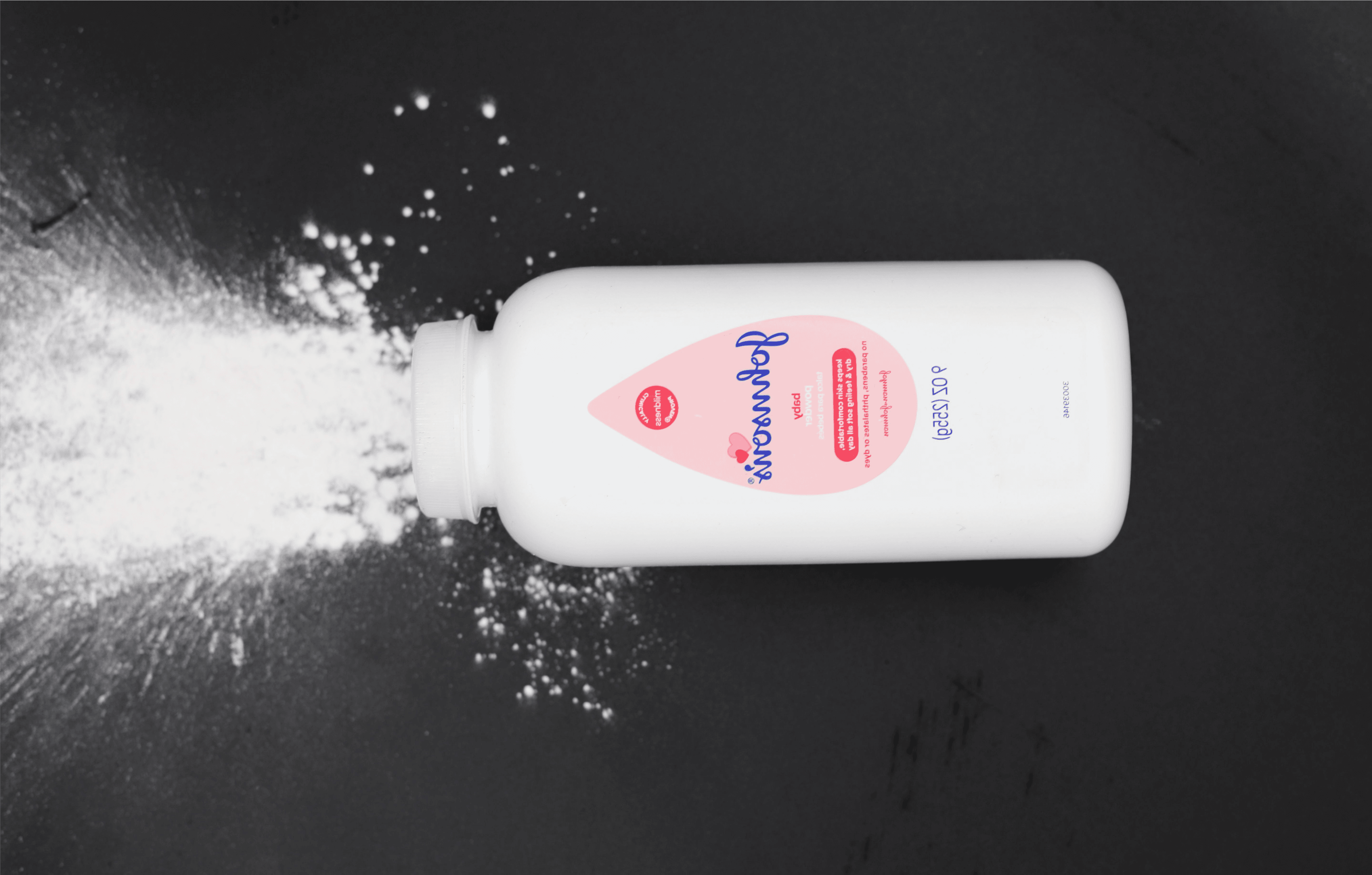 Talcum powder pouring onto a surface linked to ovarian cancer lawsuit and settlement claims.