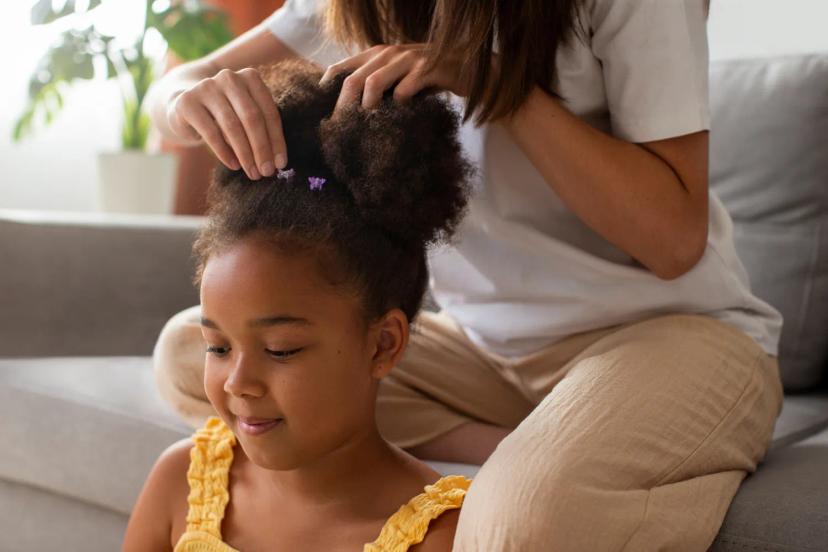 Woman with natural curls considering chemical hair straightener risks and lawsuits